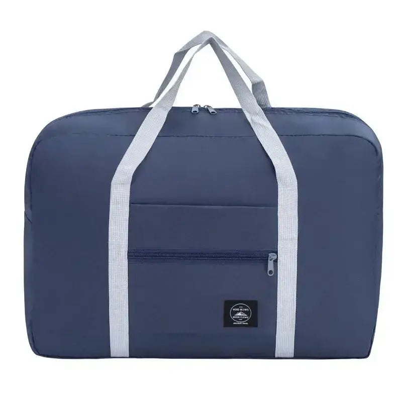 Nevytech Women’s Travel Handbag Waterproof in blue and pink colors displayed on a wooden chair.