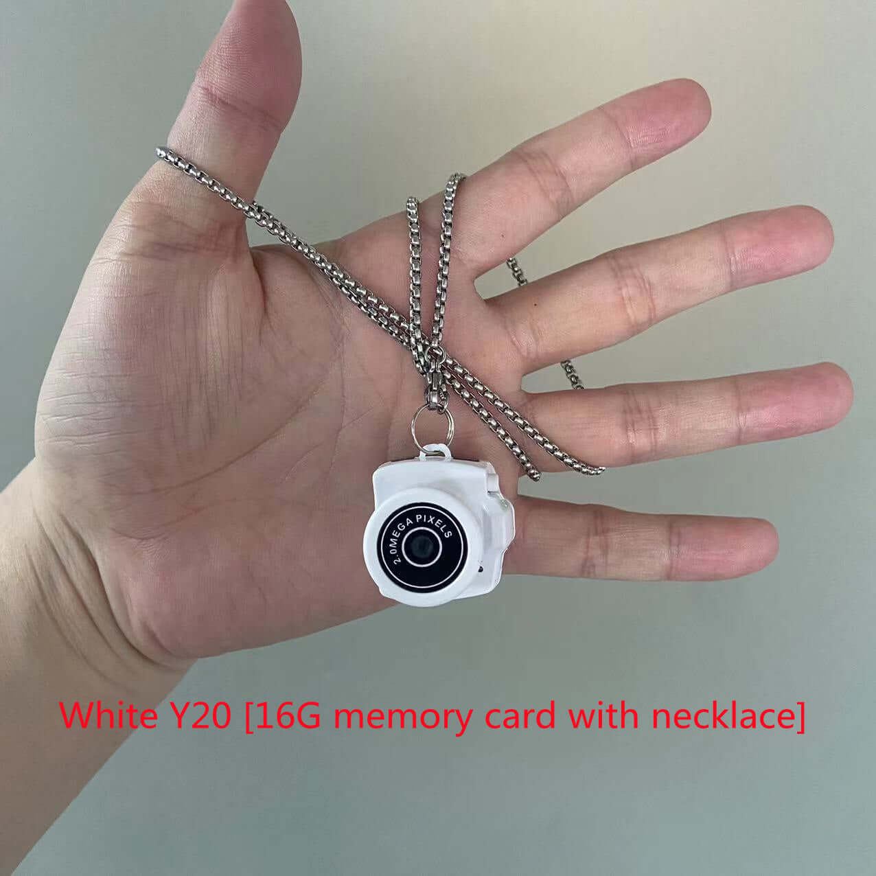 White Y20 camera necklace with 16G memory card, perfect for capturing moments on-the-go.