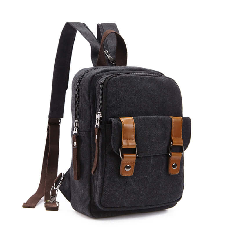 Casual outdoor travel backpack in black fabric with brown accents, featuring zipper openings and multiple storage compartments.