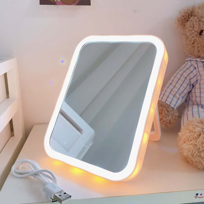 LED desktop vanity mirror with soft lighting, portable design perfect for bedroom makeup use.
