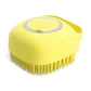 Yellow pet dog shampoo massager brush with silicone bristles for bathing and grooming short-haired pets.