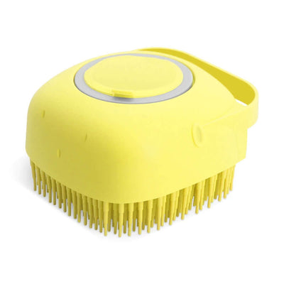 Yellow pet dog shampoo massager brush with silicone bristles for bathing and grooming short-haired pets.