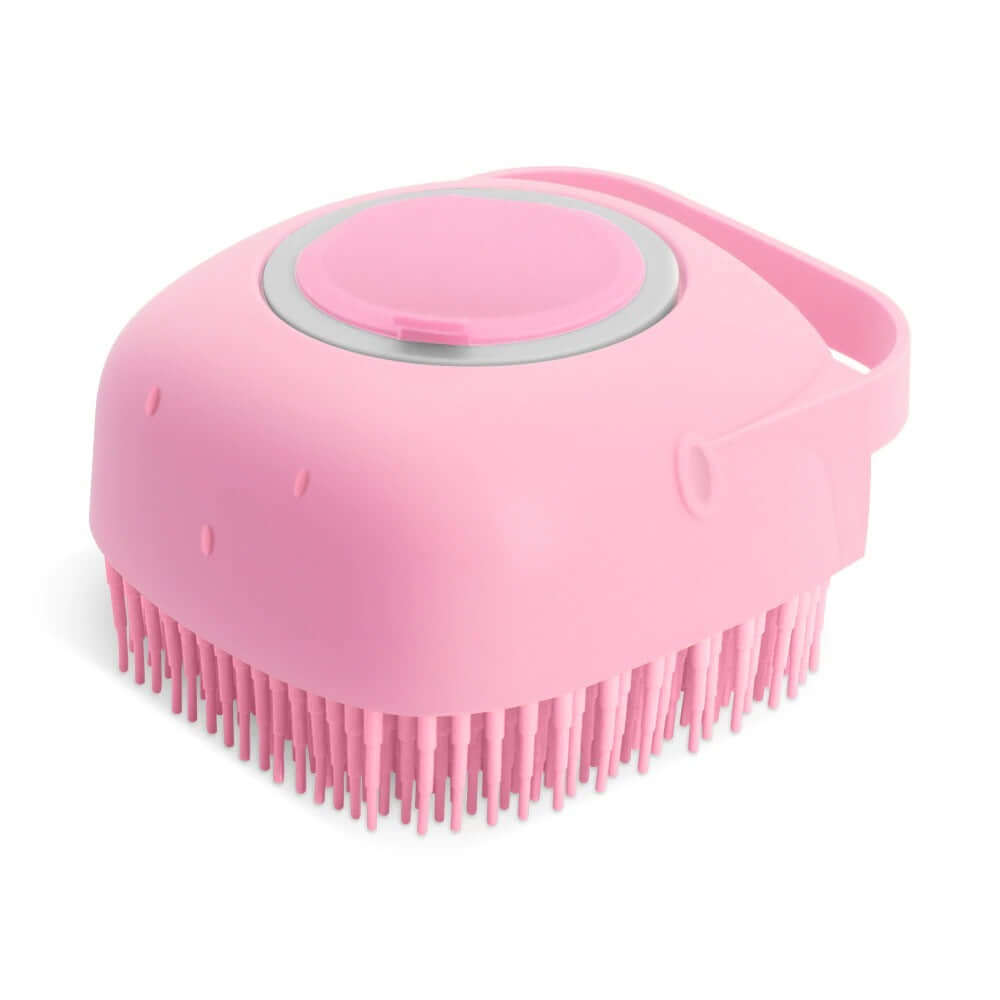 Pink pet dog shampoo massager brush with silicone bristles for grooming and bathing short-haired animals.