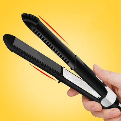 Hand holding a black tourmaline ceramic hair curler with 31mm diameter for wet and dry hair styling.