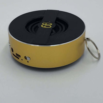 Portable outdoor Bluetooth speaker Q9A with mono output and 8 hours playtime in gold design.