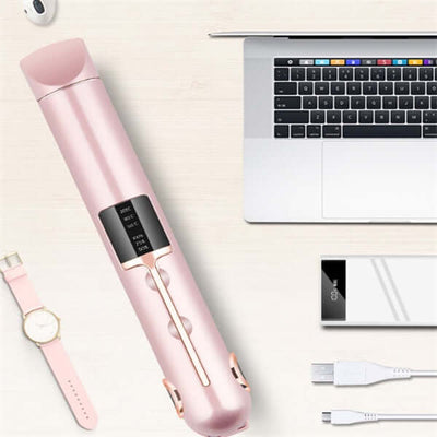 Wireless splint hair straightener in pink next to a laptop and charging cables, showcasing sleek design and adjustable temperature.