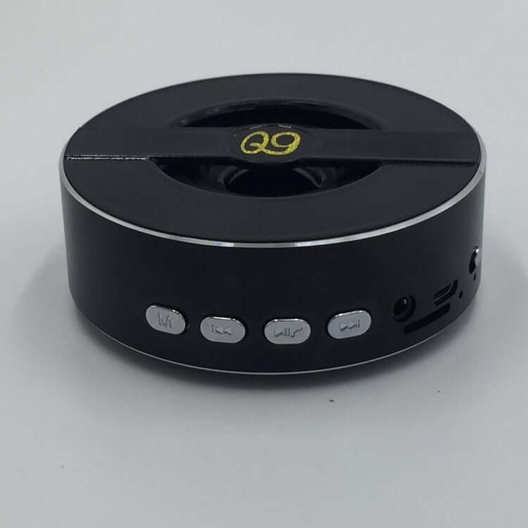 Q9A outdoor Bluetooth speaker featuring mono output, control buttons, and sleek black design.