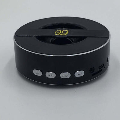 Q9A outdoor Bluetooth speaker featuring mono output, control buttons, and sleek black design.