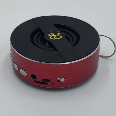 Compact red Bluetooth speaker Q9A with mono output, USB charging, and 10m transmission distance for outdoor use.