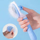 Hand holding a blue pet hair removal gadget comb for effective grooming of cats and dogs.
