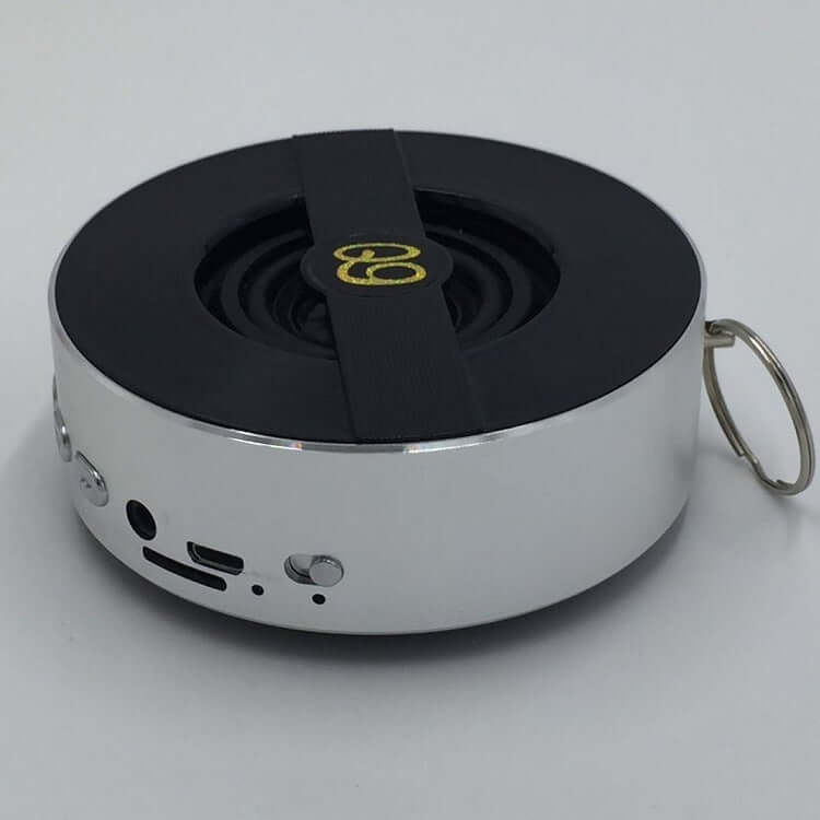 Bluetooth speaker Q9A with mono output, USB port, and compact design for outdoor use.