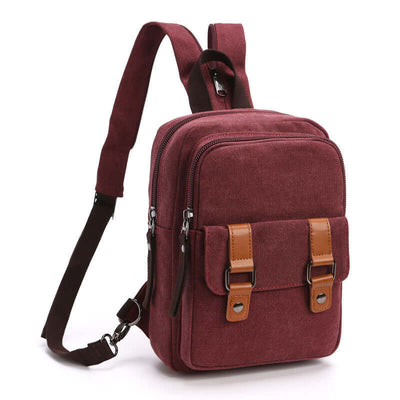 Stylish casual outdoor travel backpack with square shape, zipper opening, and brown leather accents in burgundy color.