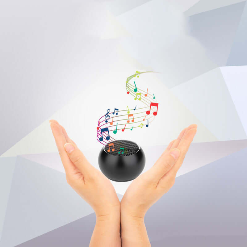 Nevytech Hands holding a portable mini Bluetooth speaker with musical notes floating above, showcasing its sound quality and portability.