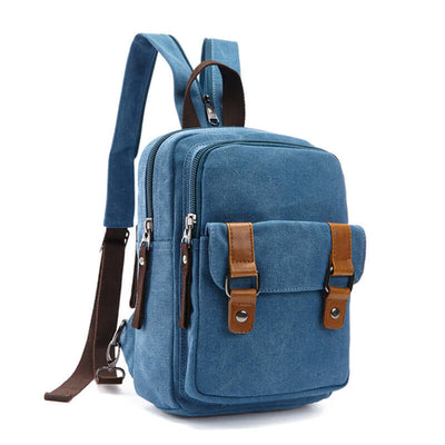 Outdoor travel backpack in blue with brown straps, featuring pockets and a zipper opening for casual use.