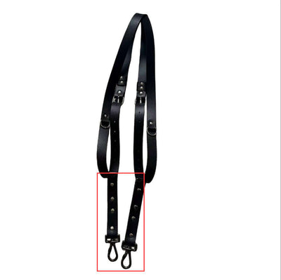 Black leather camera strap with metal clips, perfect for travel and photography needs, stylish and durable accessory.
