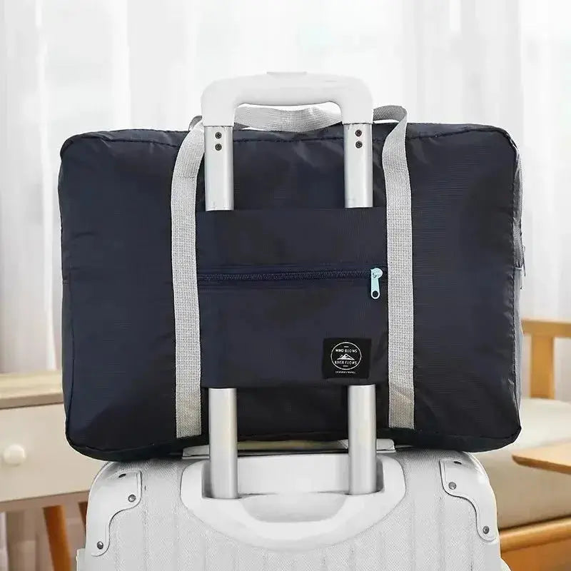 Nevytech Women’s Travel Handbag Waterproof in blue and pink colors displayed on a wooden chair.