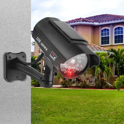 Dummy CCTV camera with flashing red LED light mounted on a wall for theft deterrent, suitable for indoor or outdoor use.