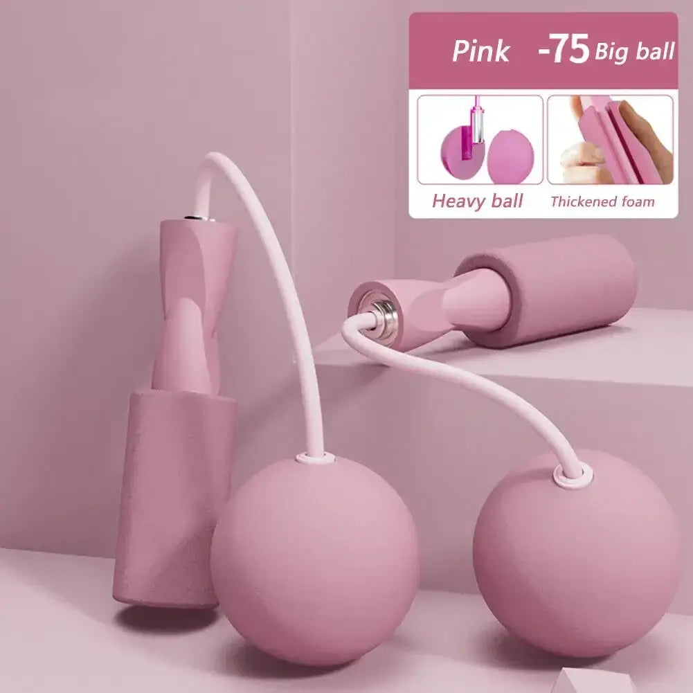 Cordless skipping rope with heavy balls in pink, designed for fitness training and aerobics, showcasing thickened foam grips.
