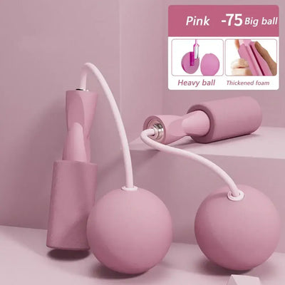 Cordless skipping rope with heavy balls in pink, designed for fitness training and aerobics, showcasing thickened foam grips.