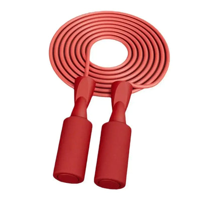 Red cordless skipping rope with comfortable handles for fitness training and aerobics.