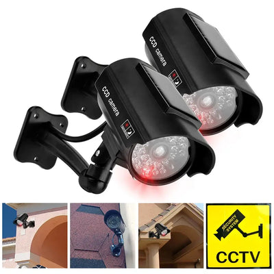 Dummy CCTV camera with flashing red LED lights, designed for indoor and outdoor theft deterrent use.