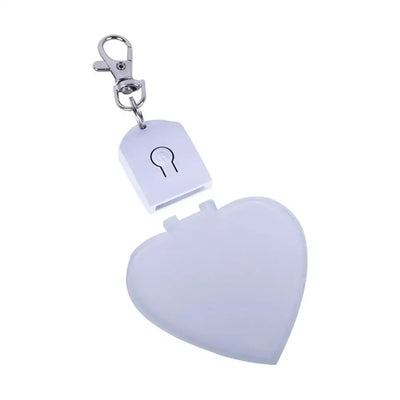 Heart-shaped LED light keychain for purses, portable and rechargeable, perfect accessory for women and girls.