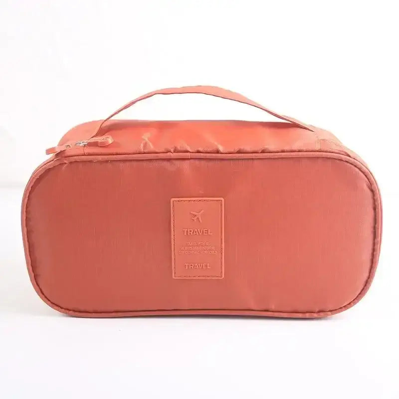 Lightweight travel underwear organizer bag in terracotta color, perfect for packing cubes for women on the go.