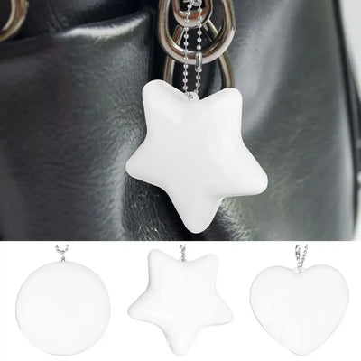 LED handbag light in star shape with keychain clip, ideal for purses, available in heart, round, and star design.