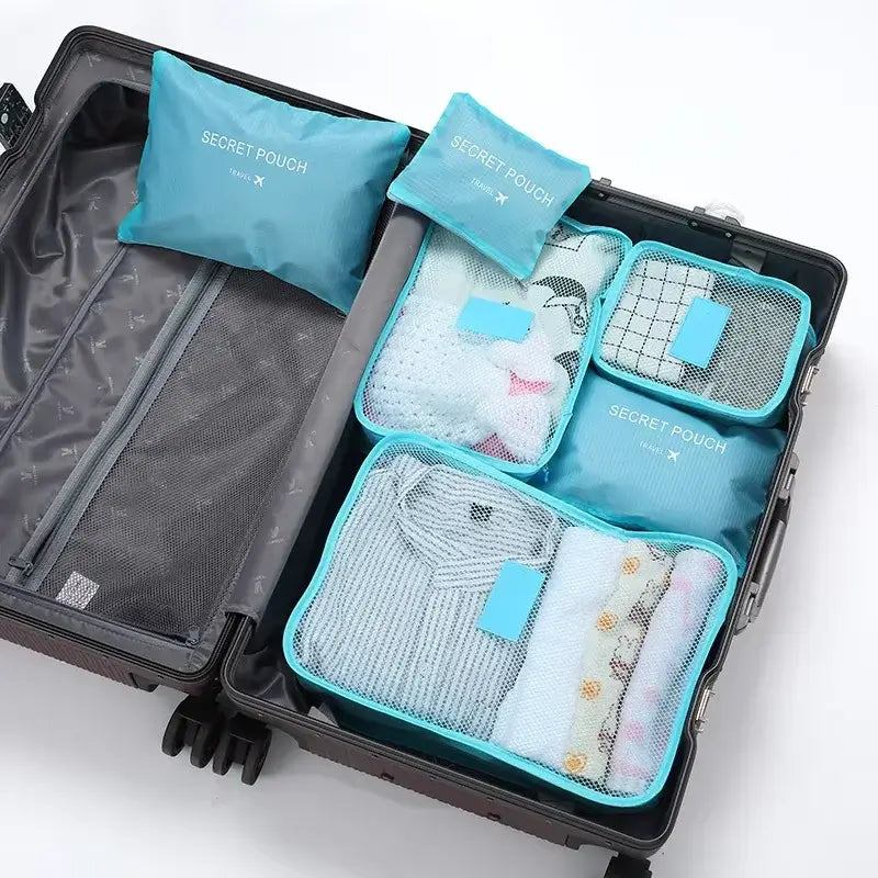 6-piece travel packing cubes neatly organized in a suitcase, including a secret pouch for storing clothes and accessories.