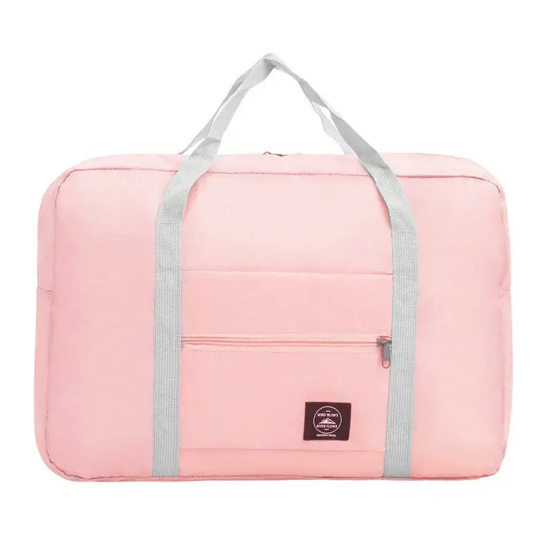 Pink travel handbag with gray straps, large capacity, waterproof, and multifunctional front pocket for easy storage.