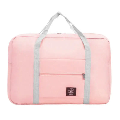 Pink travel handbag with gray straps, large capacity, waterproof, and multifunctional front pocket for easy storage.