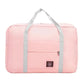 Nevytech Women’s Travel Handbag Waterproof in blue and pink colors displayed on a wooden chair.
