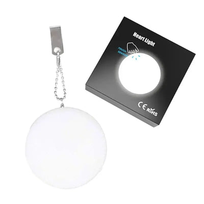 Purse Heart LED Light in white, heart-shaped design, with packaging, perfect for women's handbag decoration.