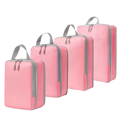 Set of four pink ultralight packing cubes for travel, designed for effective compression and organization.