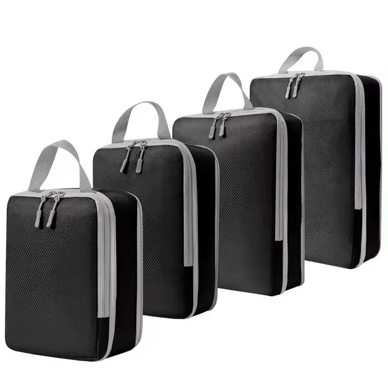 Set of four black ultralight packing cubes with zippers for efficient travel organization and compression.