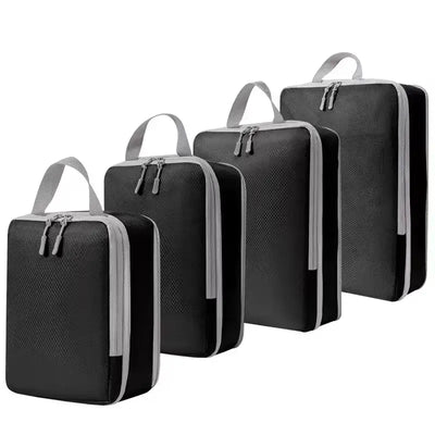 Set of four black ultralight packing cubes with zippers for efficient travel organization and compression.