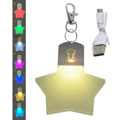 Colorful rechargeable star-shaped LED light keychain with USB cable for outdoor and travel use.