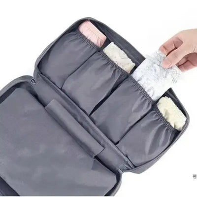 Lightweight travel underwear organizer bag showing neatly packed bras and undergarments for women.