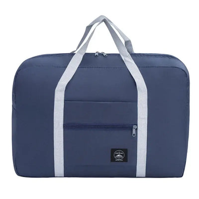 Large capacity travel handbag in navy blue with reinforced straps and front pocket for storage.