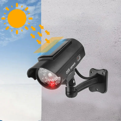 Dummy CCTV camera with flashing red LED, solar panel, and weatherproof design for outdoor security deterrence.