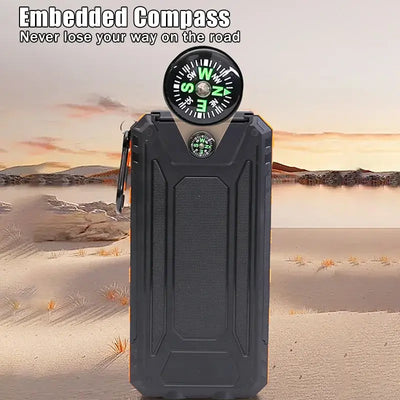 Portable power bank with embedded compass, designed for outdoor use in rugged terrain.