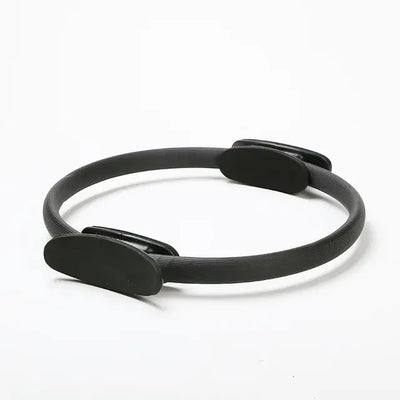 Black Pilates ring for body shaping and fitness exercises, ideal for beginners, durable and practical equipment.