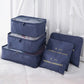 Nevytech 6Pcs Travel Packing Cubes Set organized inside a suitcase for efficient packing.