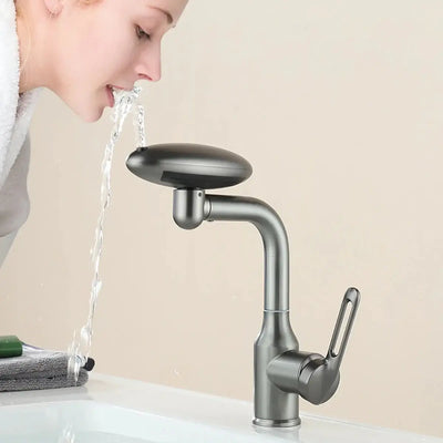 Multi functional waterfall basin faucet showcasing 360° rotation and water flow, user drinking from innovative design.