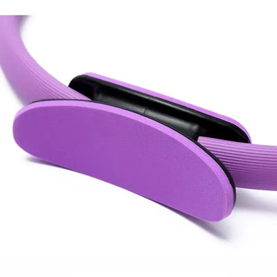 Close-up of purple Pilates ring, a durable tool for fitness and body shaping exercises.