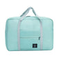 Nevytech Women’s Travel Handbag Waterproof in blue and pink colors displayed on a wooden chair.