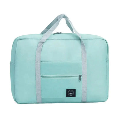 Large capacity turquoise travel handbag with reinforced straps and front pocket for easy storage.