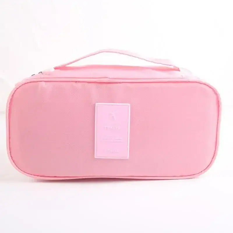 Lightweight pink travel underwear organizer bag with handle, ideal for packing cubes and travel accessories.