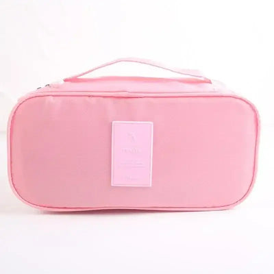 Lightweight pink travel underwear organizer bag with handle, ideal for packing cubes and travel accessories.