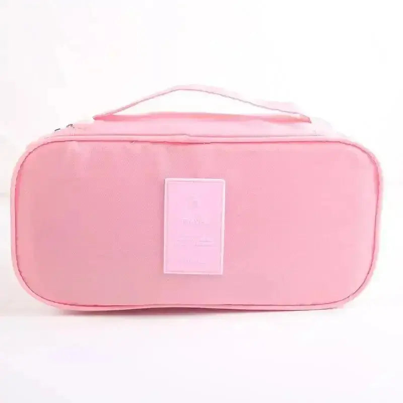 Nevytech 6Pcs Travel Luggage Packing Cubes organized in pink suitcase with laundry pouch and clothing.